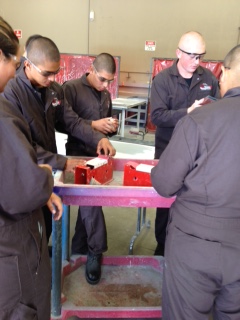 Students working in an auto shop